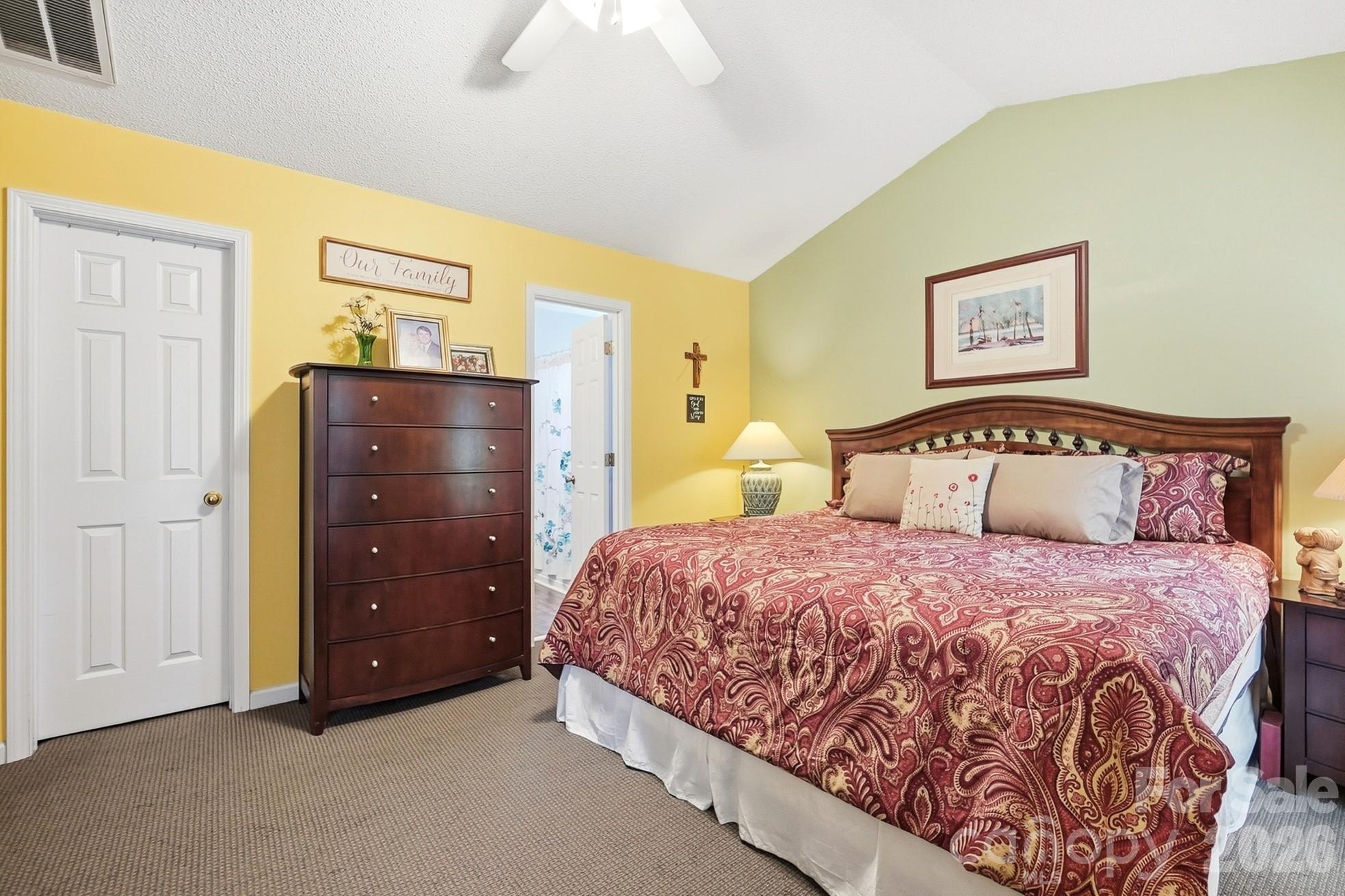 442 Sugar Maple Drive Tega Cay, SC 29708 - Photo 20 of 48 a bedroom with a bed and painting on the wall