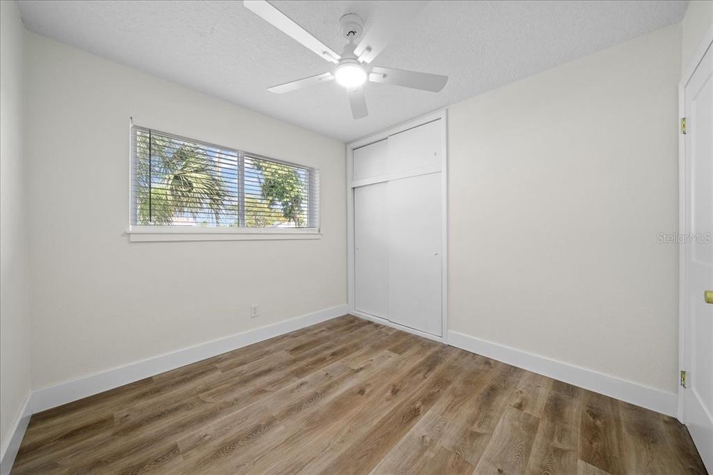 145 Southeast 3rd Street Satellite Beach, FL 32937 - Photo 14 of 29 wooden floor in an empty room with a window