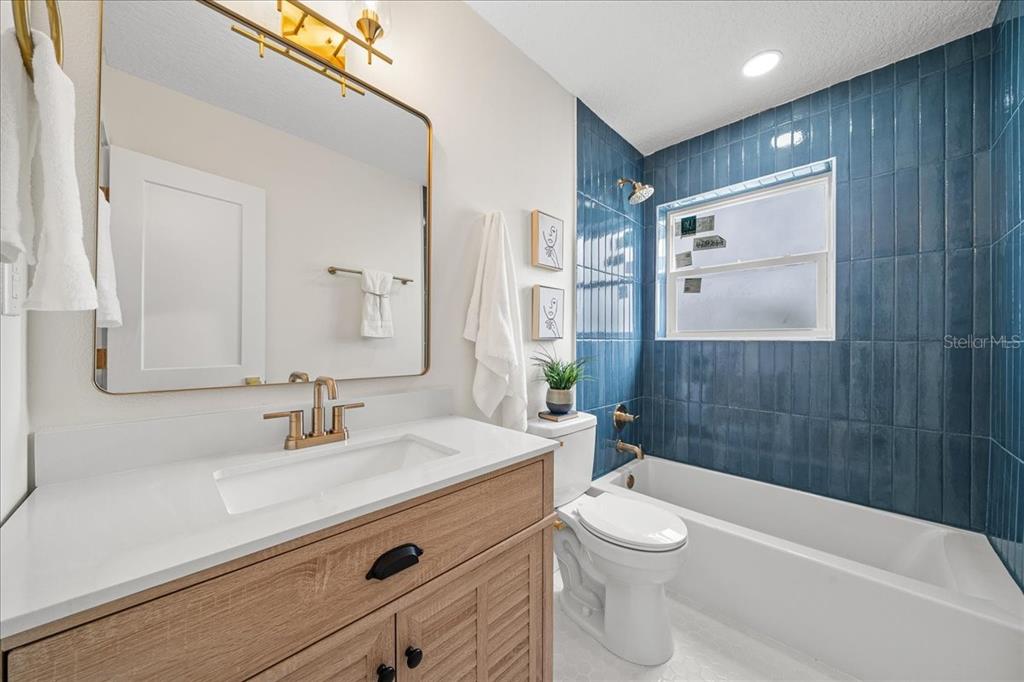 145 Southeast 3rd Street Satellite Beach, FL 32937 - Photo 16 of 29 a bathroom with a sink a toilet and shower