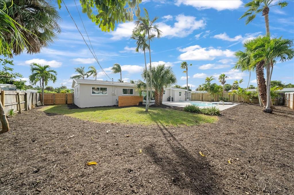 145 Southeast 3rd Street Satellite Beach, FL 32937 - Photo 21 of 29 a view of a house with a yard
