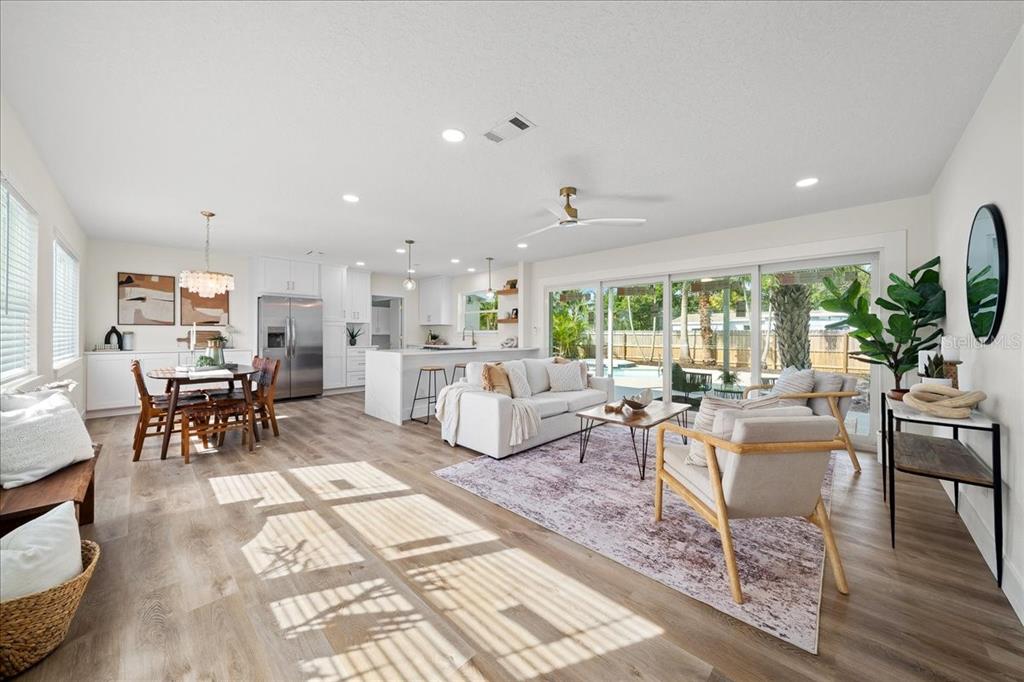 145 Southeast 3rd Street Satellite Beach, FL 32937 - Photo 3 of 29 a living room with furniture and a table