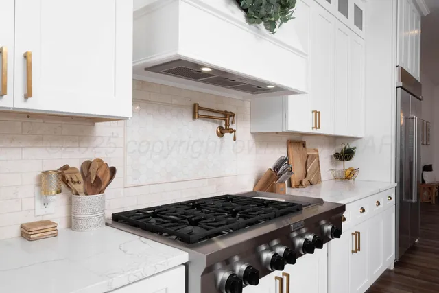 a white bath tub sitting next to a white sink