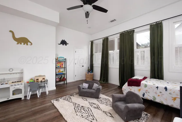 a front view of house with yard and trees