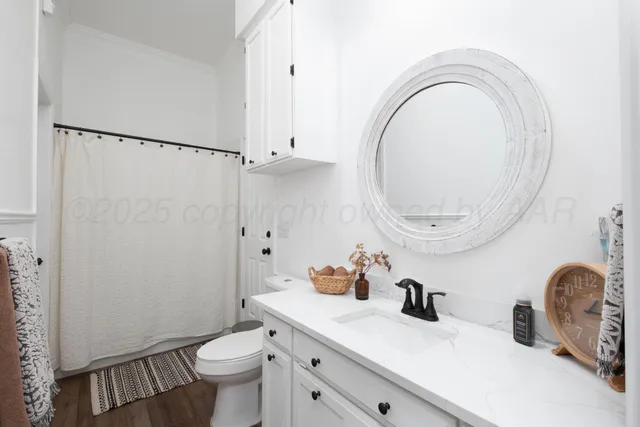 a view of empty room with a fireplace