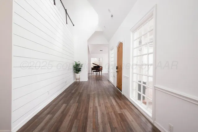 a view of a living room and hardwood floor