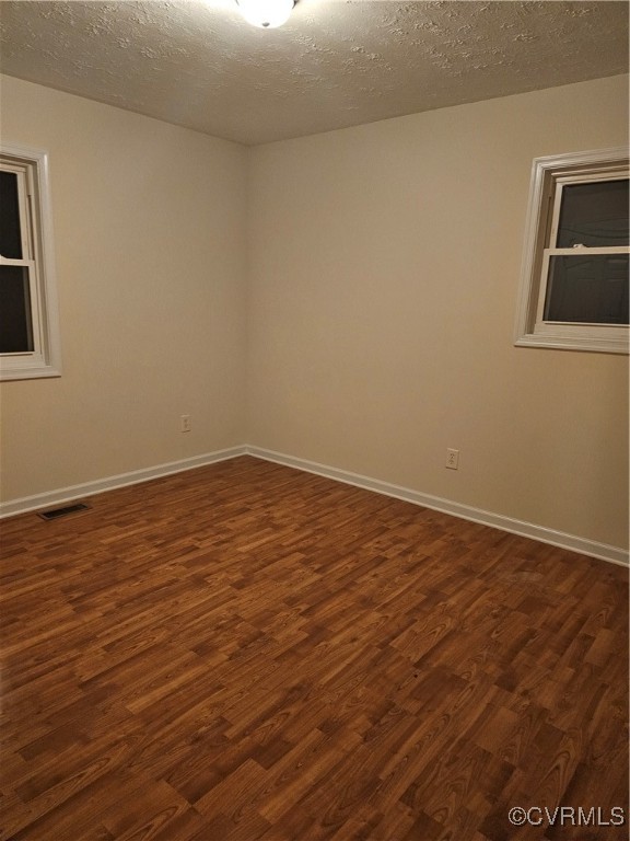 4488 Shannon Hill Road Columbia, VA 23038 - Photo 13 of 22 a view of an empty room with wooden floor and a window