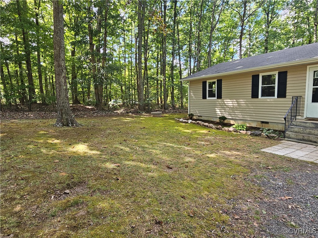 4488 Shannon Hill Road Columbia, VA 23038 - Photo 20 of 22 a view of a house with backyard and trees