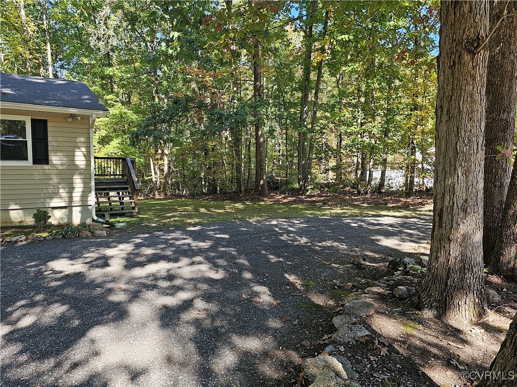 4488 Shannon Hill Road Columbia, VA 23038 - Photo 22 of 22 a backyard of a house with lots of green space