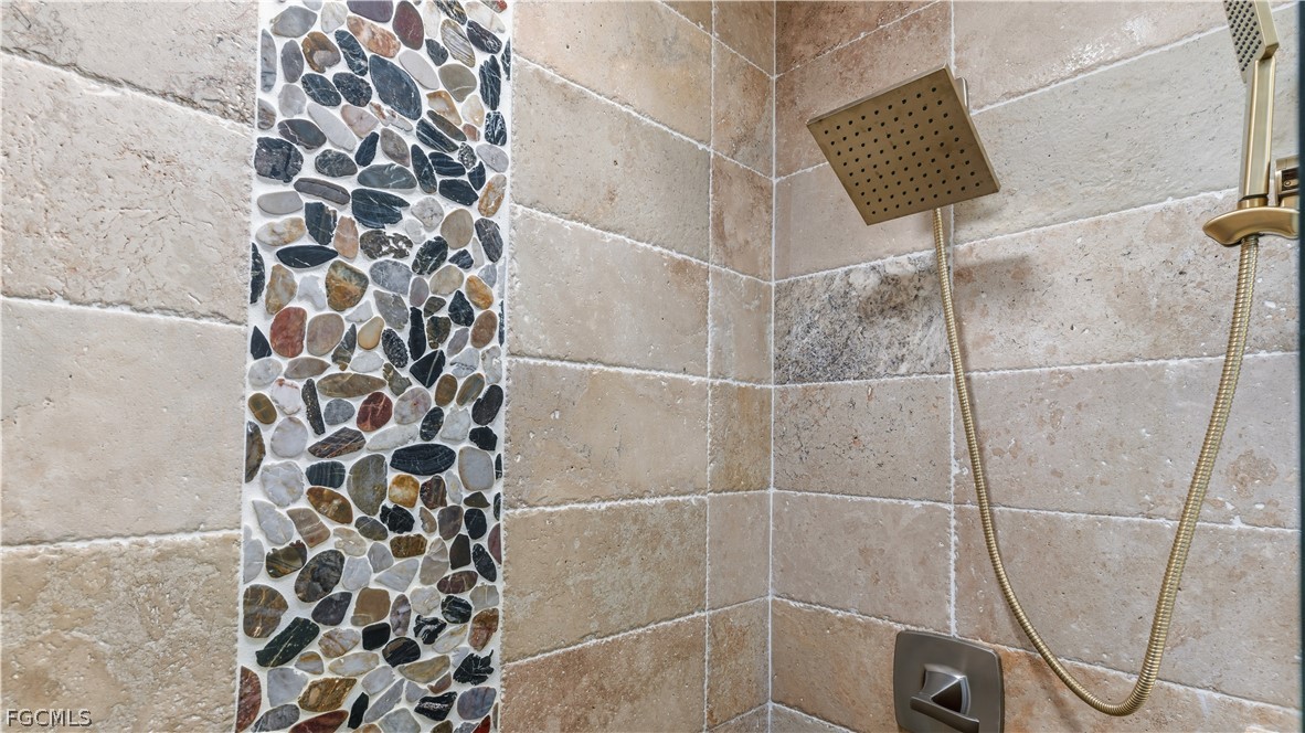 939 Bluebird Street Naples, FL 34104 - Photo 23 of 29 a bathroom with a shower and a shower