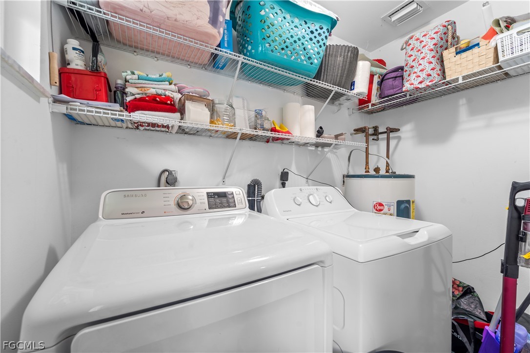 939 Bluebird Street Naples, FL 34104 - Photo 25 of 29 a utility room with dryer and washer