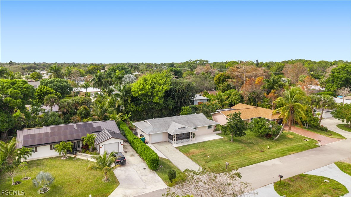 939 Bluebird Street Naples, FL 34104 - Photo 29 of 29 an aerial view of a house with a yard