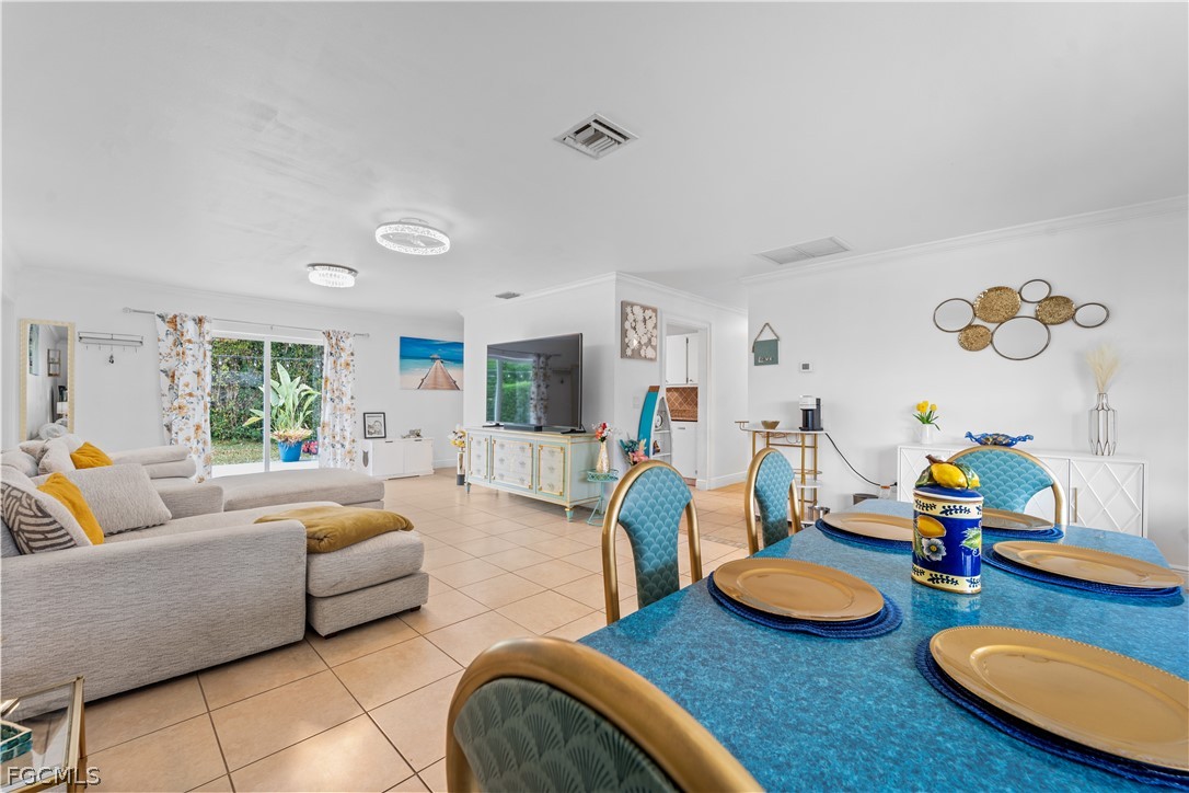 939 Bluebird Street Naples, FL 34104 - Photo 5 of 29 a living room with furniture and wooden floor