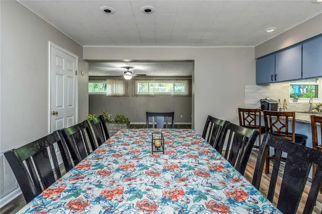 a view of a room with a ceiling fan and a window