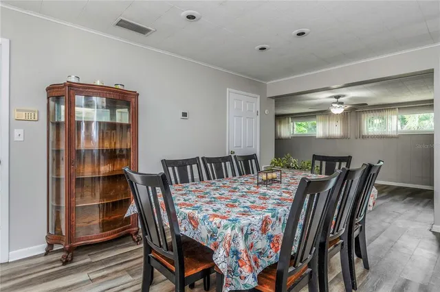 a kitchen with granite countertop stainless steel appliances stove a sink and dishwasher next to a window