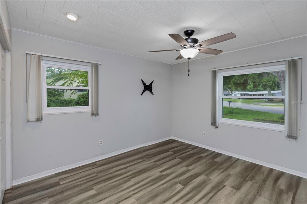 310 Terrace Drive Brandon, FL 33510 - Photo 18 of 80 a view of a room with a ceiling fan and a window