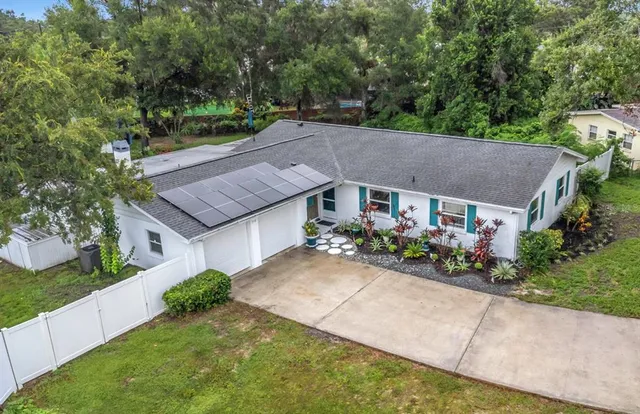 a front view of house with yard and green space