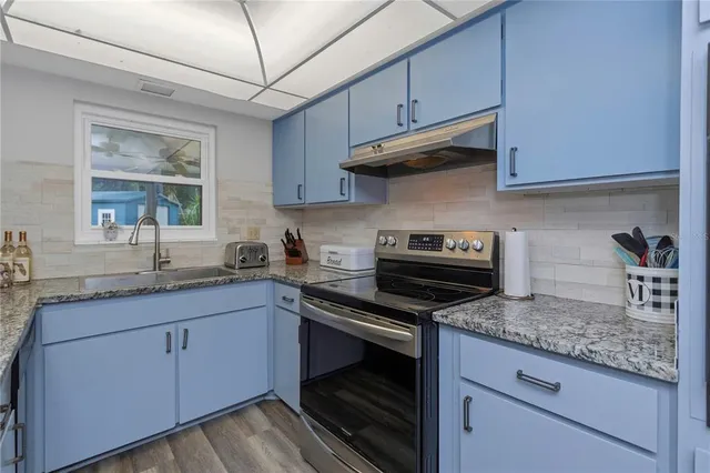 a view of an empty room and wooden floor