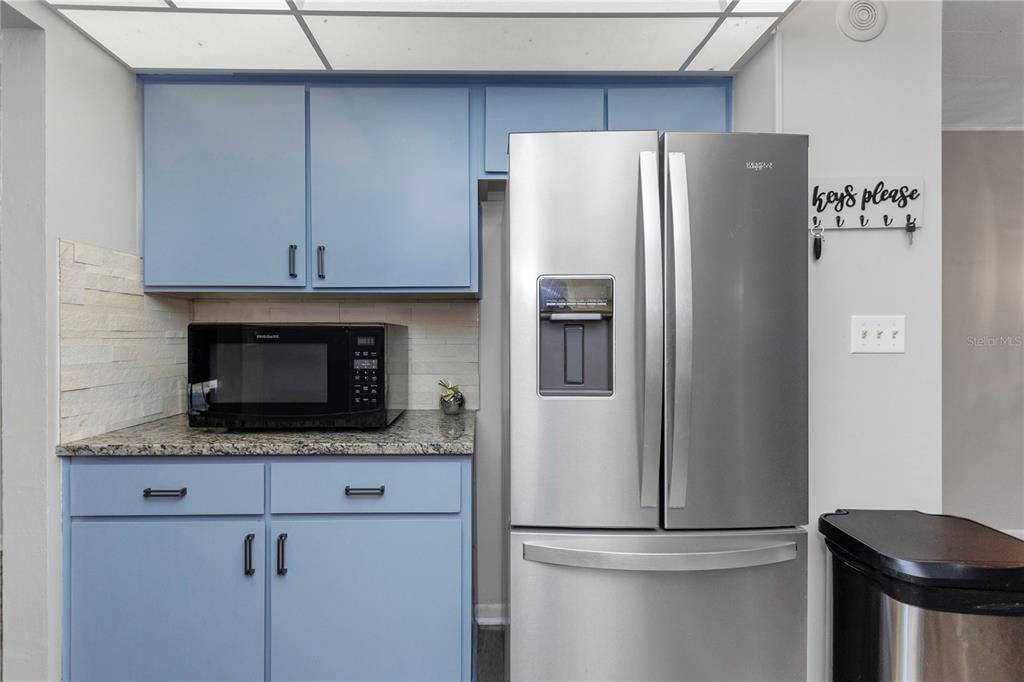 310 Terrace Drive Brandon, FL 33510 - Photo 25 of 80 a white refrigerator freezer and a stove sitting inside of a kitchen