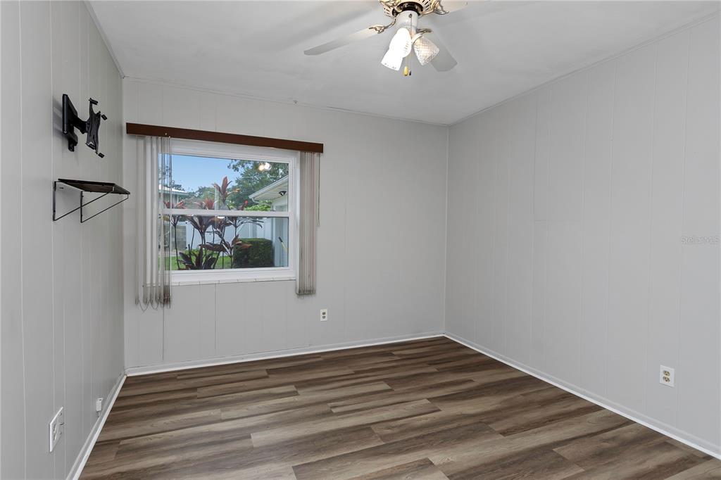 310 Terrace Drive Brandon, FL 33510 - Photo 38 of 80 a view of empty room with wooden floor and fan