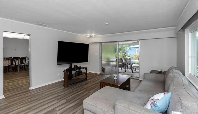 a view of house with swimming pool outdoor seating