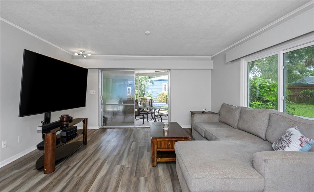 310 Terrace Drive Brandon, FL 33510 - Photo 43 of 80 a living room with furniture and a flat screen tv