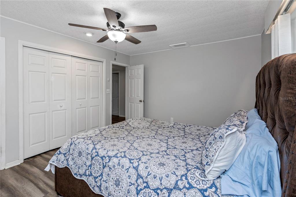 310 Terrace Drive Brandon, FL 33510 - Photo 49 of 80 a bedroom with a bed and a ceiling fan