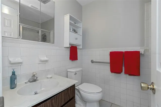 a view of a city with lush green forest