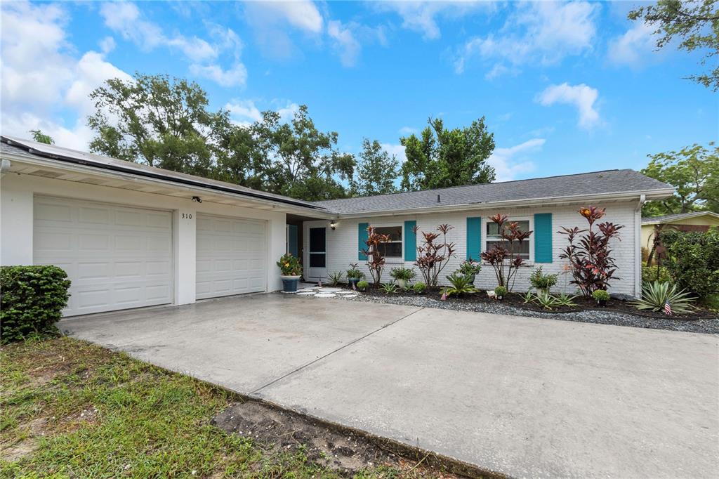 310 Terrace Drive Brandon, FL 33510 - Photo 6 of 80 a view of a house with backyard and garden