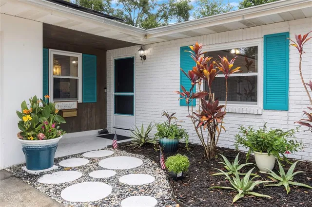 a view of a livingroom with furniture and a kitchen