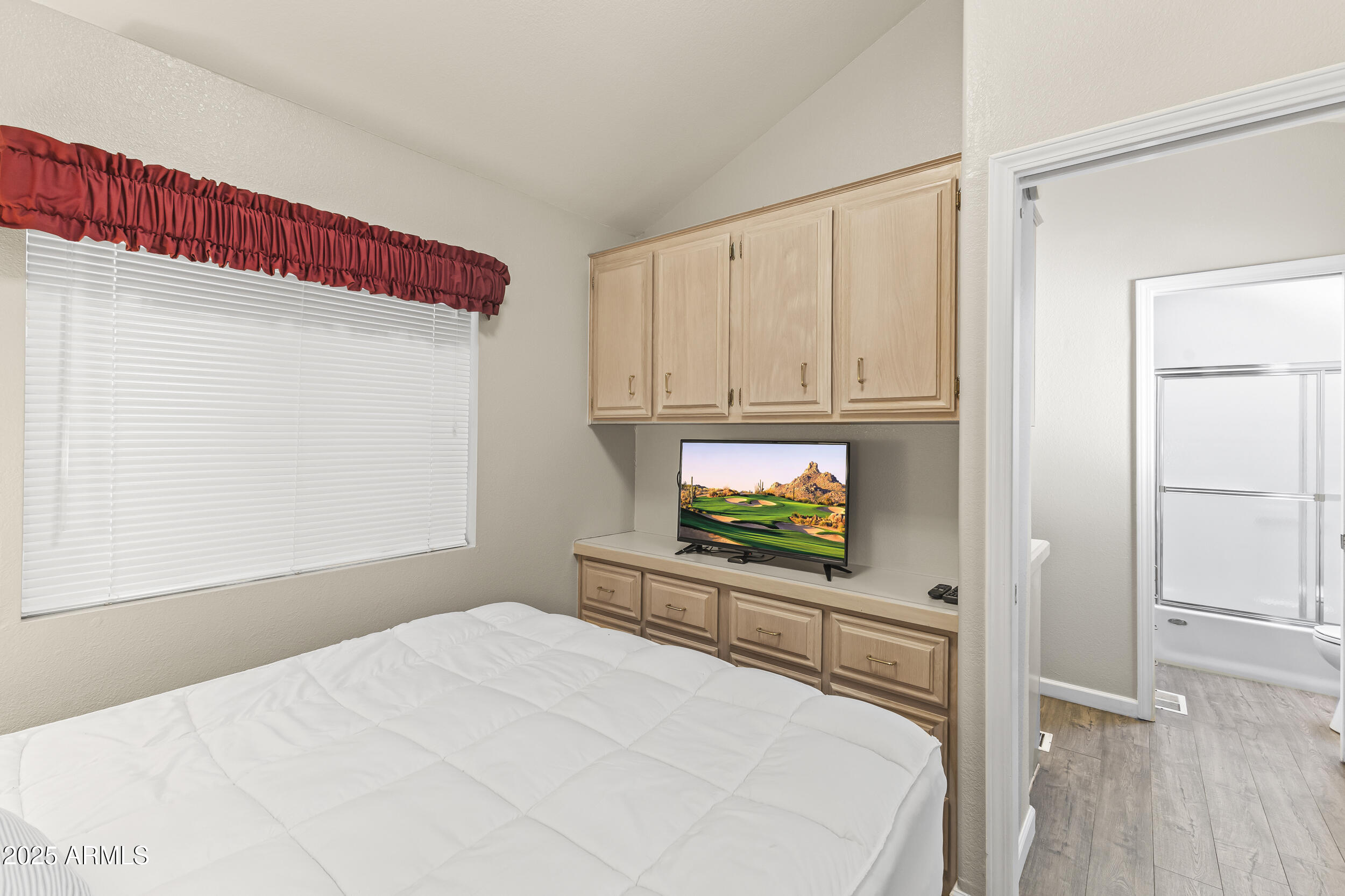 111 South Greenfield Road, Unit 238 Mesa, AZ 85206 - Photo 15 of 20 a bedroom with a bed and a television