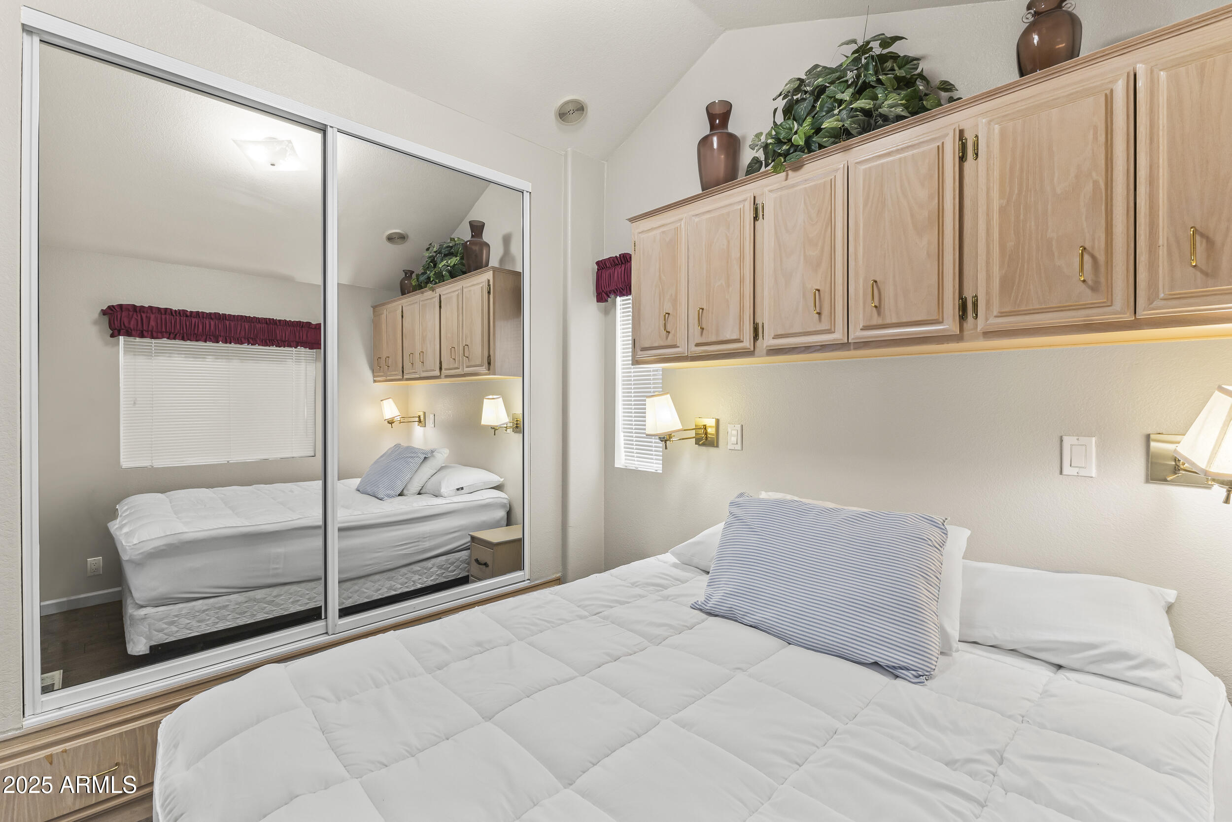 111 South Greenfield Road, Unit 238 Mesa, AZ 85206 - Photo 16 of 20 a bedroom with a large bed and a window