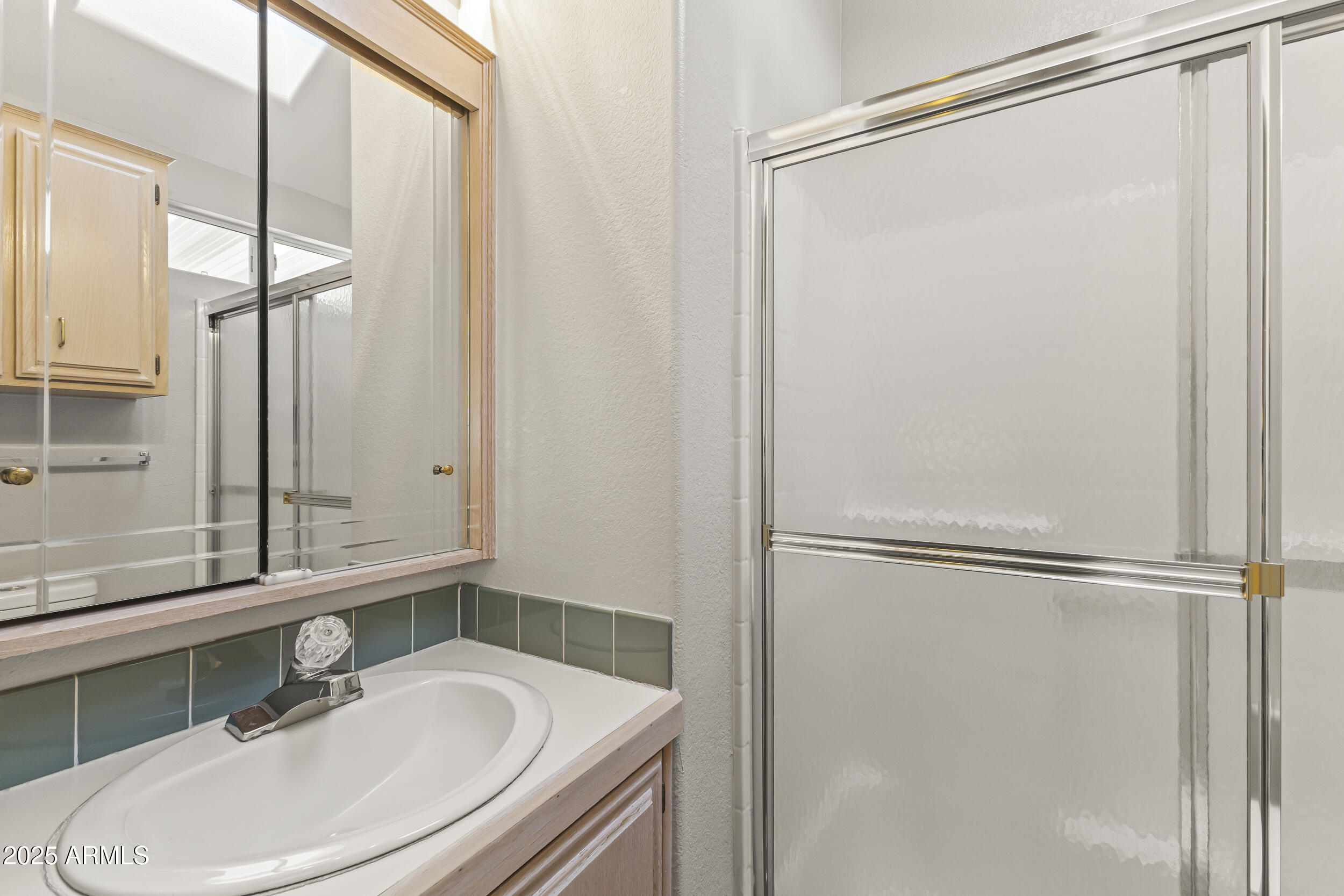 111 South Greenfield Road, Unit 238 Mesa, AZ 85206 - Photo 17 of 20 a bathroom with a sink and a mirror