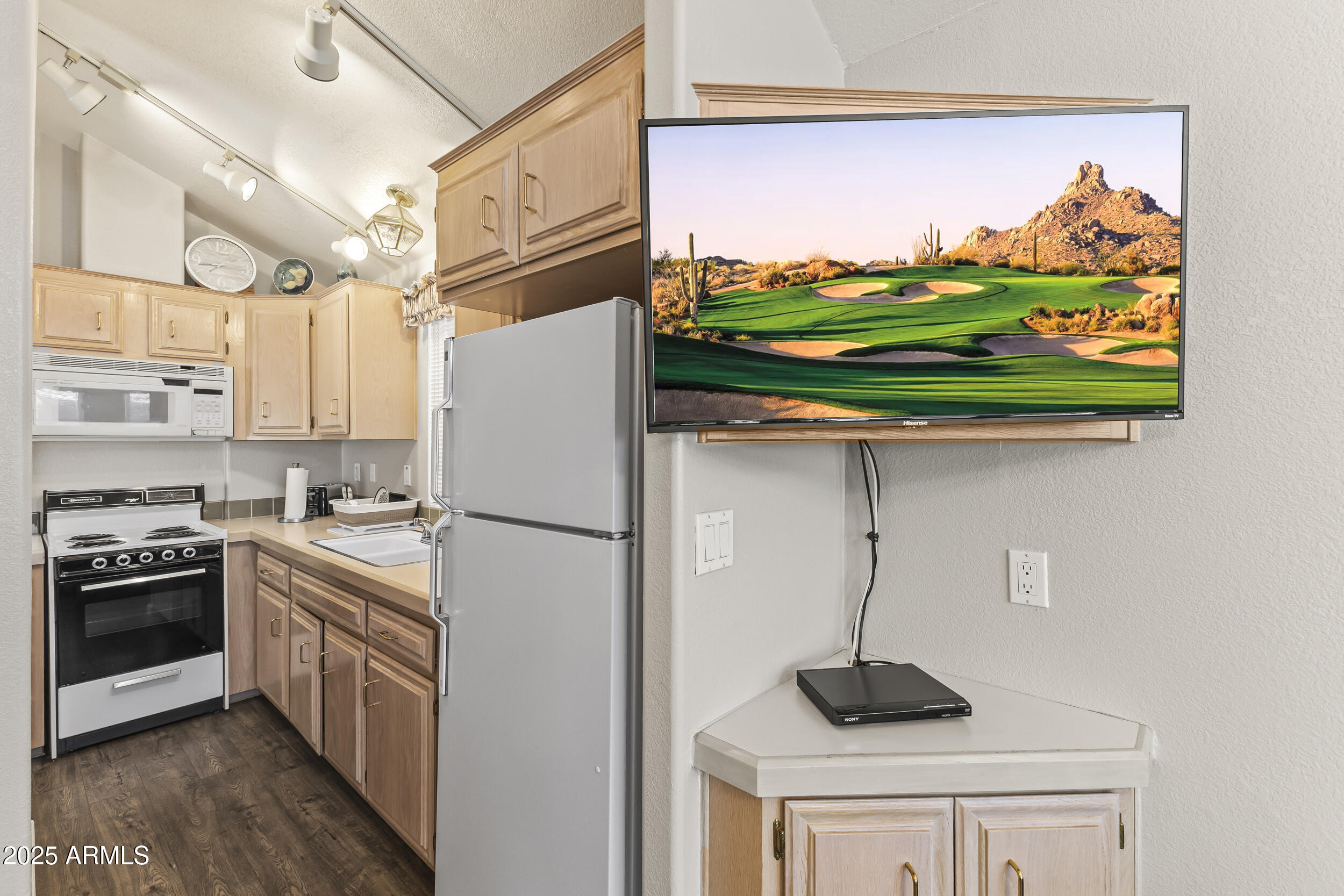 111 South Greenfield Road, Unit 238 Mesa, AZ 85206 - Photo 6 of 20 a kitchen with stainless steel appliances granite countertop a refrigerator and a stove