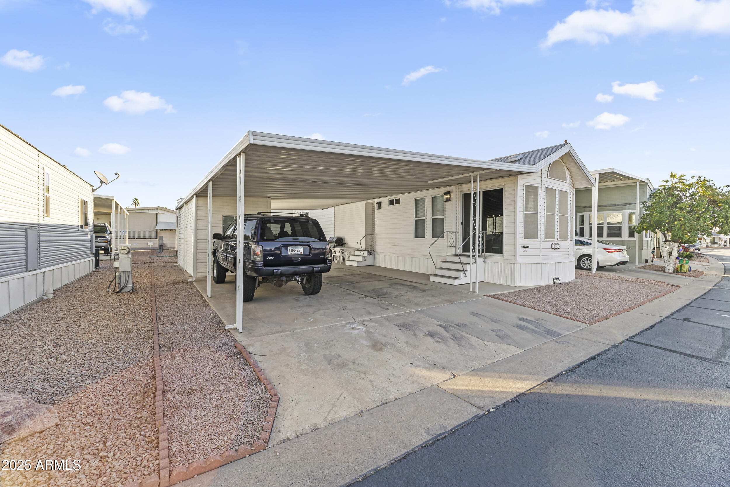 111 South Greenfield Road, Unit 238 Mesa, AZ 85206 - Photo 8 of 20 a view of a patio with furniture and a fire pit