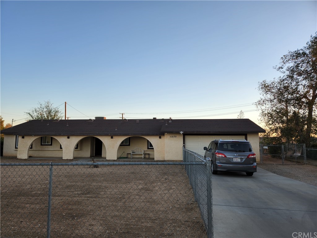 11570 Chimayo Road Apple Valley, CA 92308 - Photo 1 of 1 a car parked in front of a building