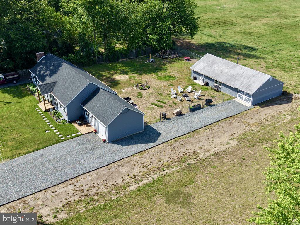 25485 Hignutt Road Denton, MD 21629 - Photo 39 of 52 an aerial view of a house with pool big yard and large trees