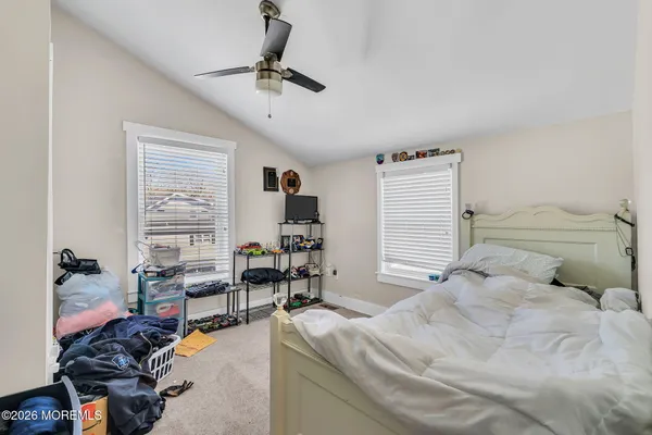 a bedroom with a bed furniture and window
