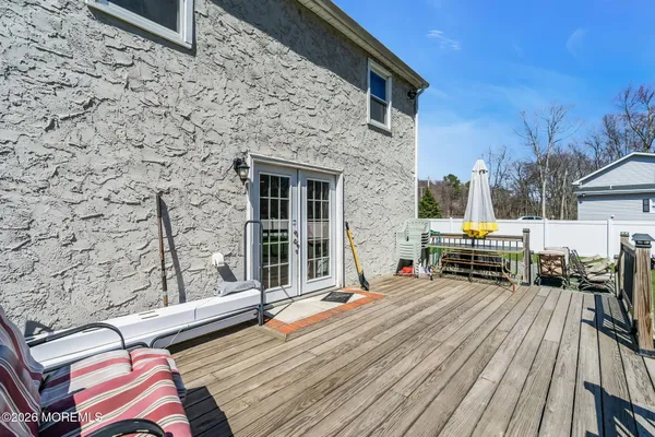 a view of a deck with chairs and a yard