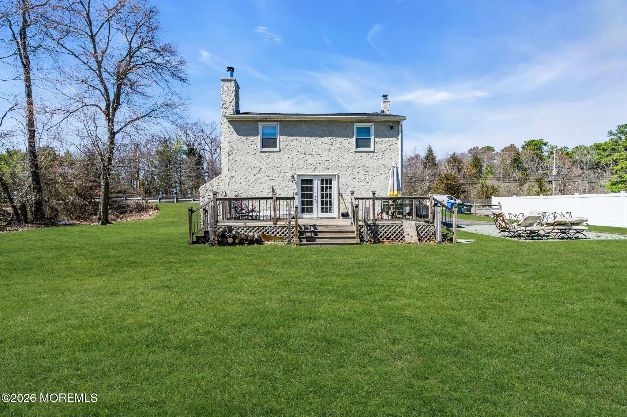 2978 Shafto Road Tinton Falls, NJ 07753 - Photo 20 of 25 a backyard of a house with table and chairs