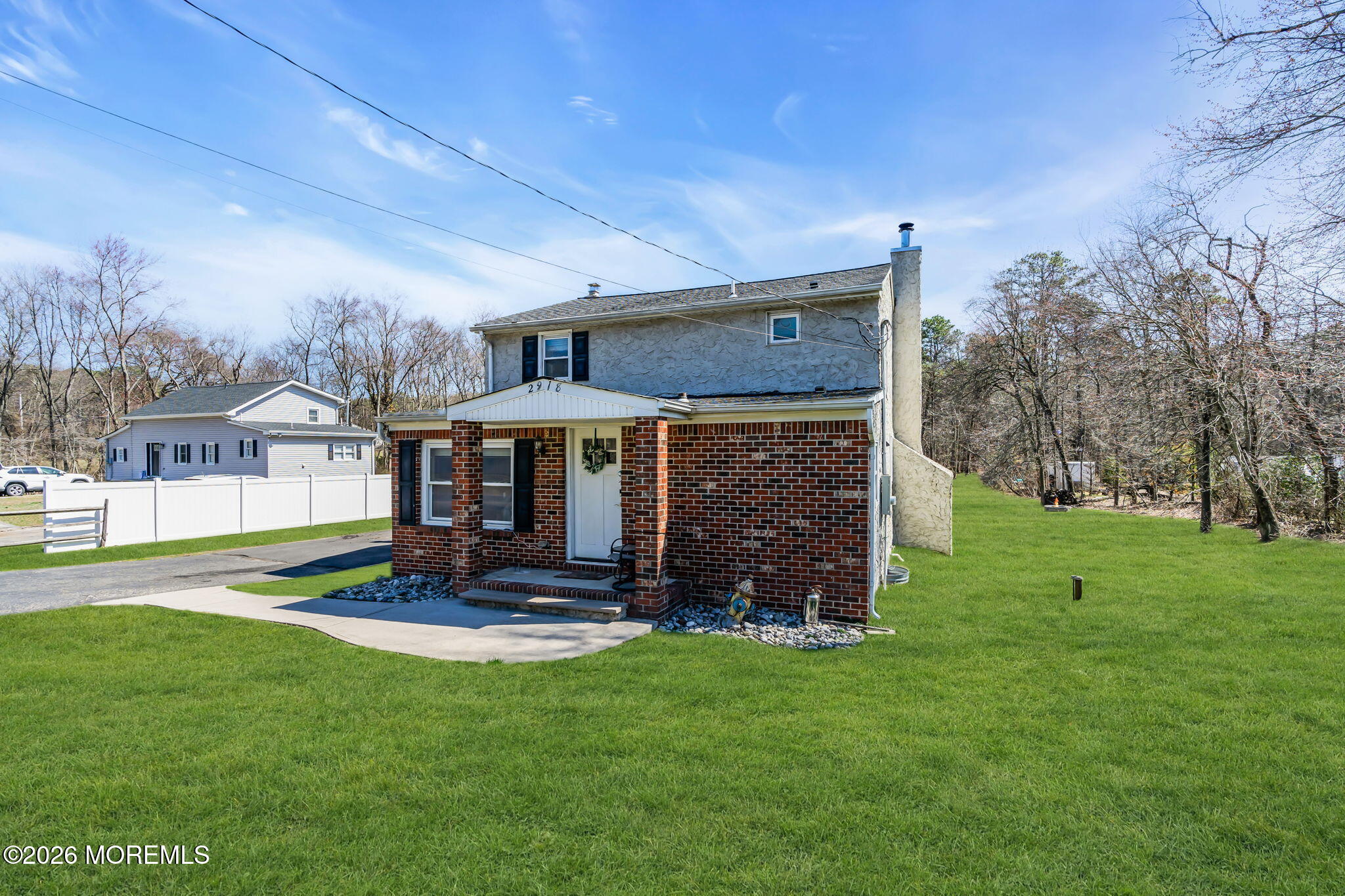 2978 Shafto Road Tinton Falls, NJ 07753 - Photo 2 of 25 a front view of a house with garden