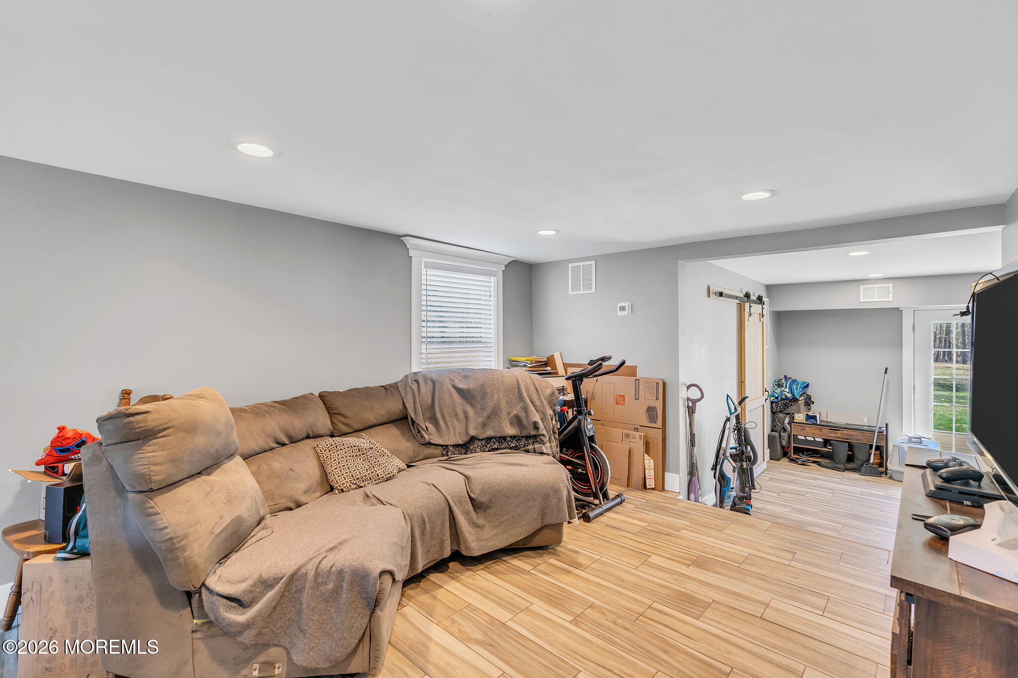 2978 Shafto Road Tinton Falls, NJ 07753 - Photo 7 of 25 a living room with furniture and a wooden floor