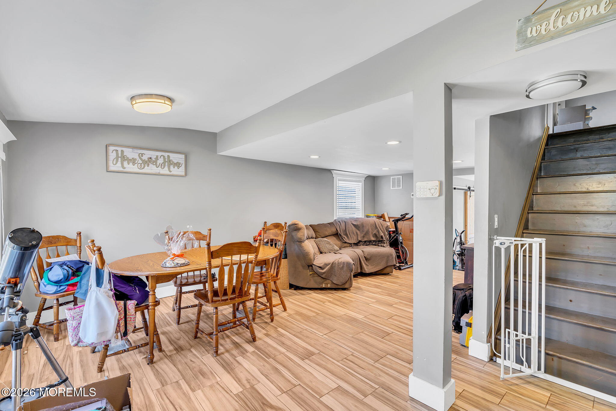 2978 Shafto Road Tinton Falls, NJ 07753 - Photo 8 of 25 a living room with furniture and a wooden floor