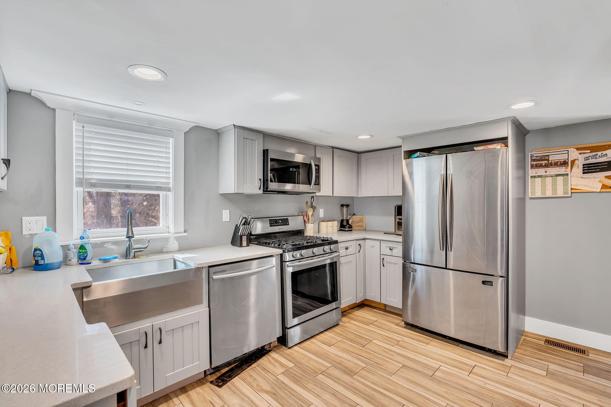 2978 Shafto Road Tinton Falls, NJ 07753 - Photo 10 of 25 a kitchen with granite countertop stainless steel appliances a sink cabinets and a window