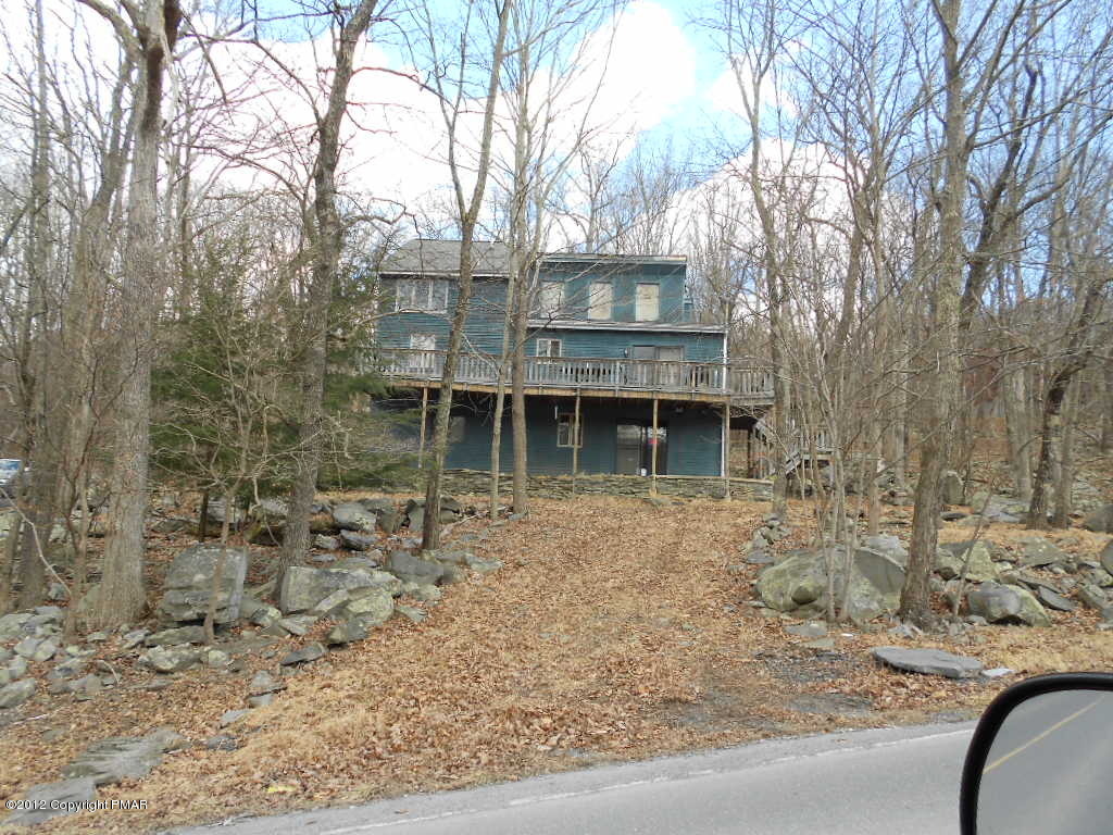 691 Decker Road Bushkill, PA 18324 - Photo 6 of 6 a front view of a house with trees