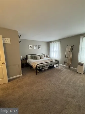 a room with bed and window