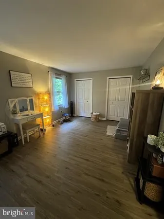 a view of a livingroom with furniture and a flat screen tv
