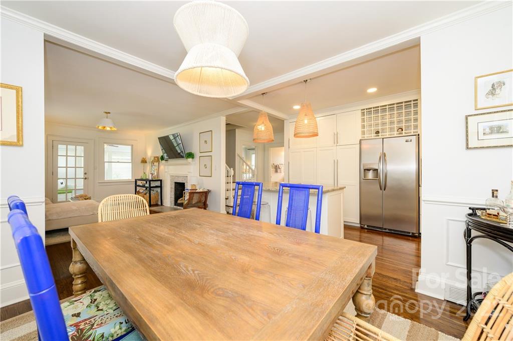 332 Marsh Road Charlotte, NC 28209 - Photo 11 of 37 a large kitchen with stainless steel appliances kitchen island granite countertop a refrigerator a stove and white cabinets with wooden floor