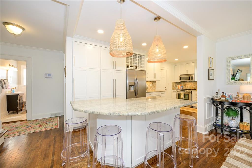 332 Marsh Road Charlotte, NC 28209 - Photo 12 of 37 a kitchen with stainless steel appliances granite countertop a sink and a refrigerator