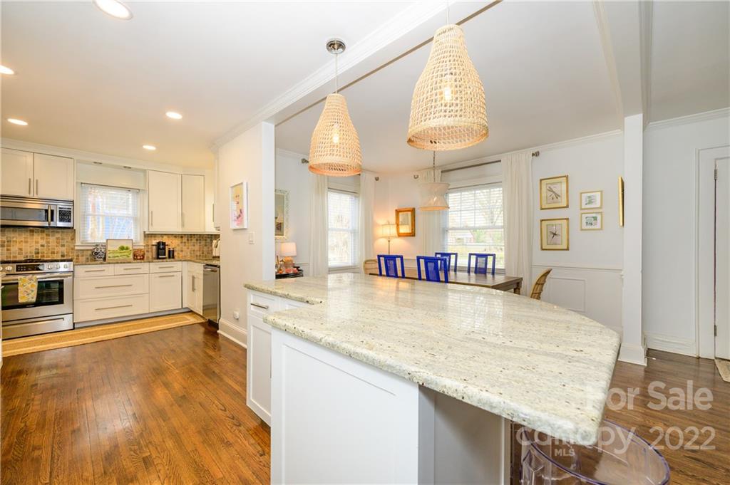 332 Marsh Road Charlotte, NC 28209 - Photo 13 of 37 a large kitchen with a large counter top appliances and cabinets