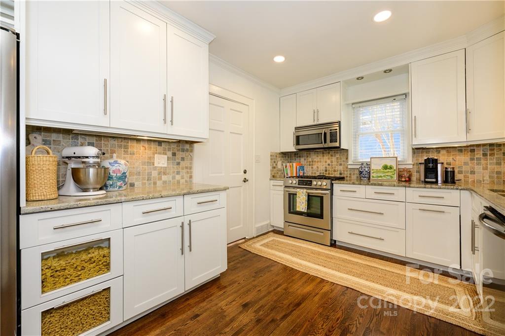 332 Marsh Road Charlotte, NC 28209 - Photo 15 of 37 a kitchen with granite countertop white cabinets and appliances